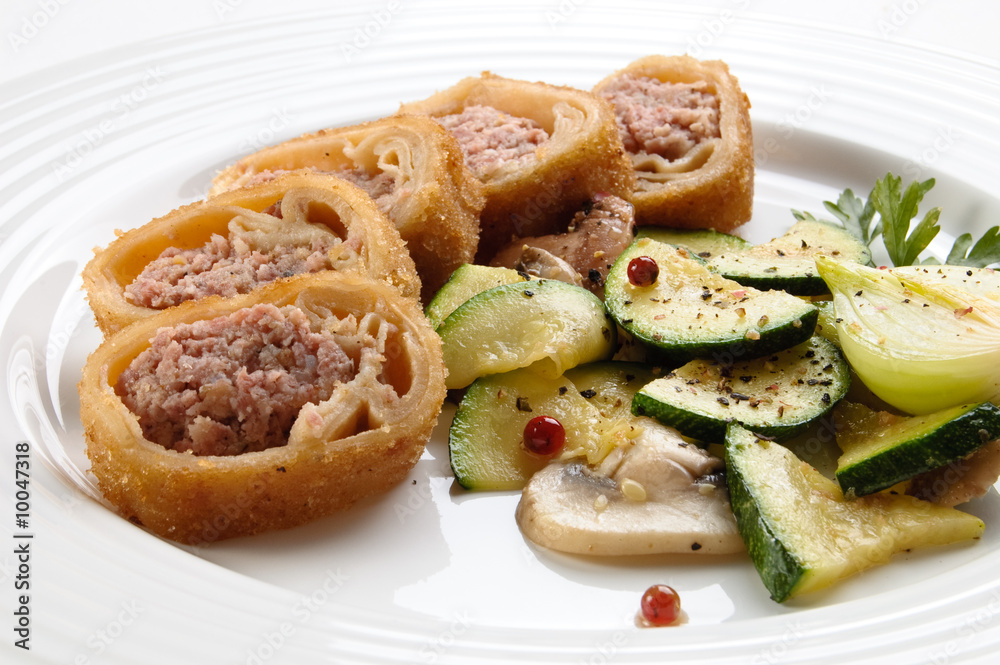 Stuffed fried pancakes with meat and vegetable salad Stuffed fried pancakes with meat and vegetable salad