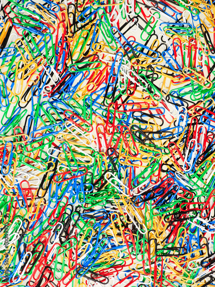 Paper clips of different colors background