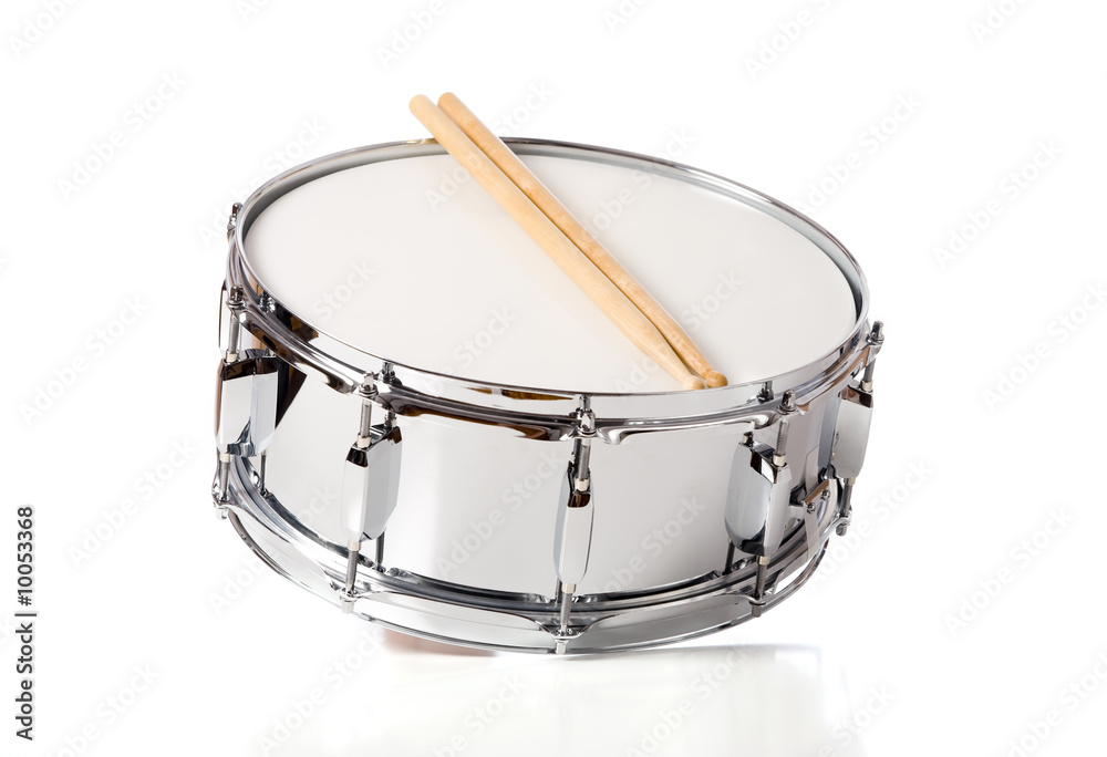 Fototapeta premium A new silver snare drum with sticks on a white background