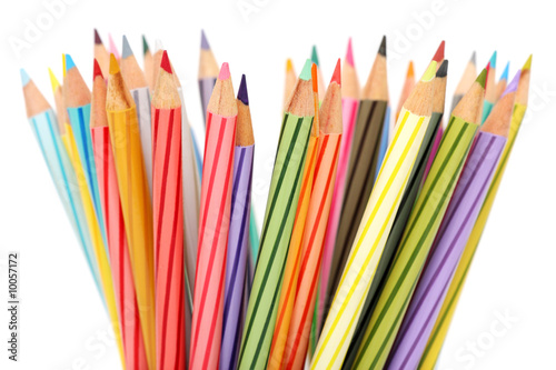 Close up of colorful color pencils over white background.