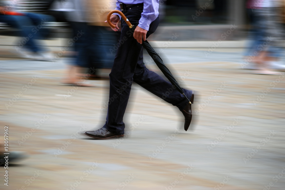 Fototapeta premium Motion effect applied to man in busy highstreet