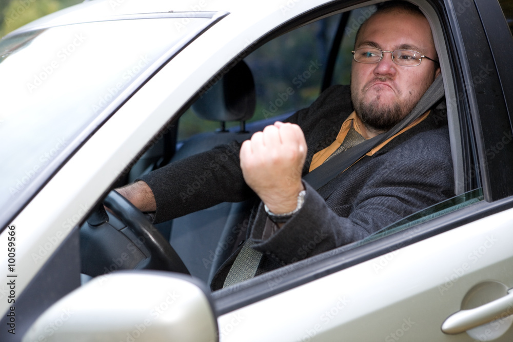 angry man driving by car