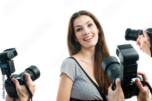 Photographers are taking a picture of a film star