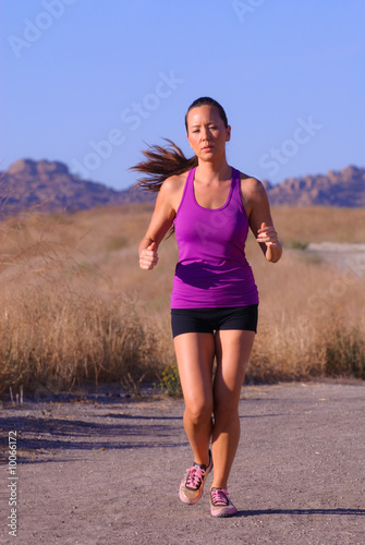 beautiful asian female runner in purple top