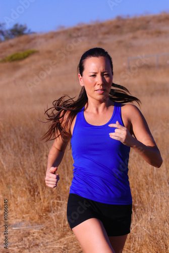 beautiful asian female runner with long hair