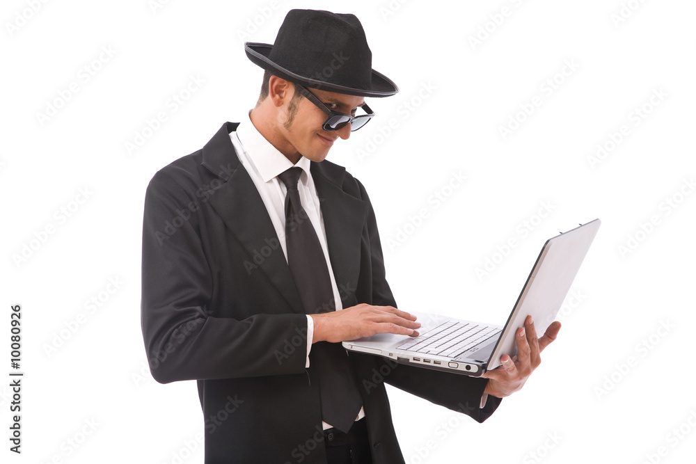 funny looking computer hacker with a laptop on white funny looking computer hacker with a laptop on white