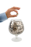 man's hand puts money into the glass