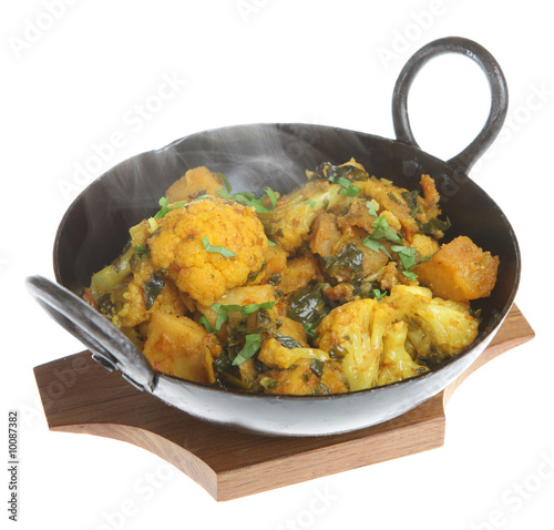 Indian vegetable curry with cauliflower, spinach and potatoes