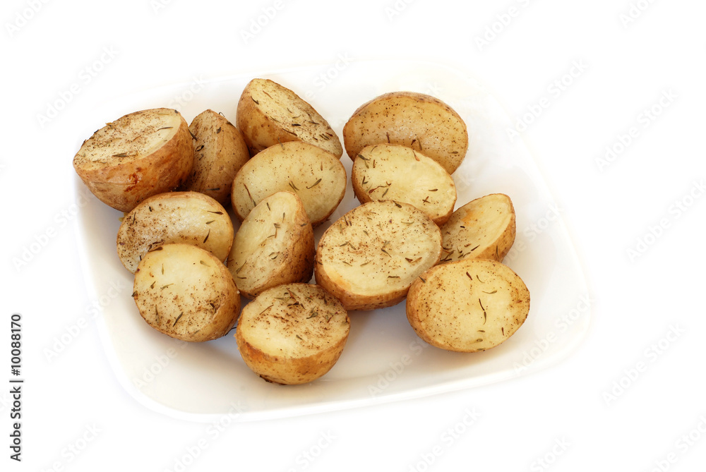 Roasted potatoes with rosemary on a plate isolated on white Roasted potatoes with rosemary on a plate isolated on white