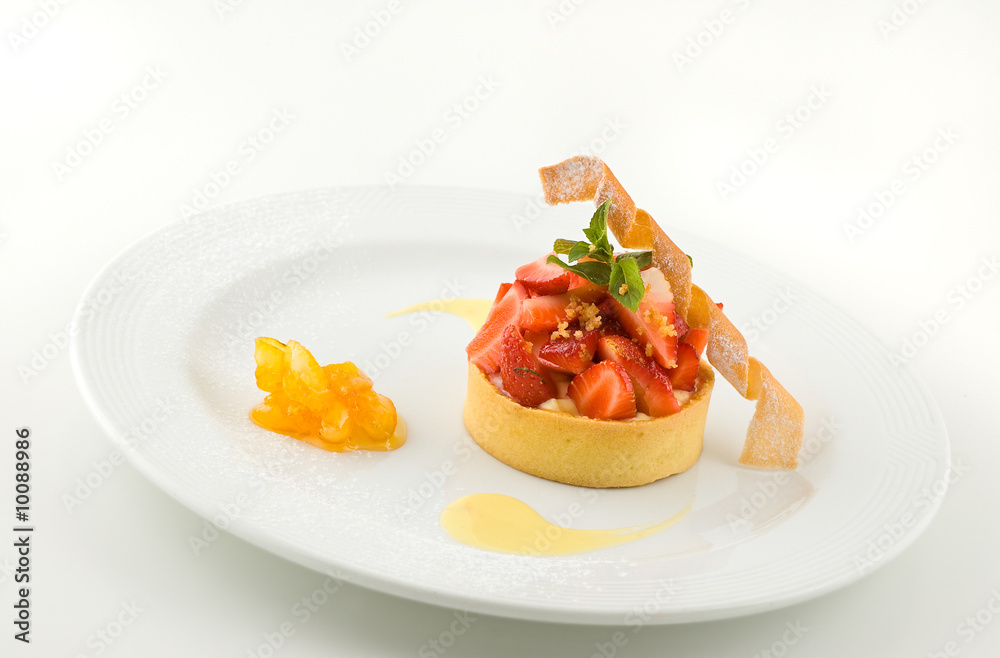 Sweet dessert with strawberries, on white, studio shot. Sweet dessert with strawberries, on white, studio shot.
