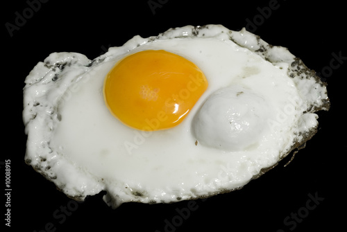A shot of a fired egg isolated on black.