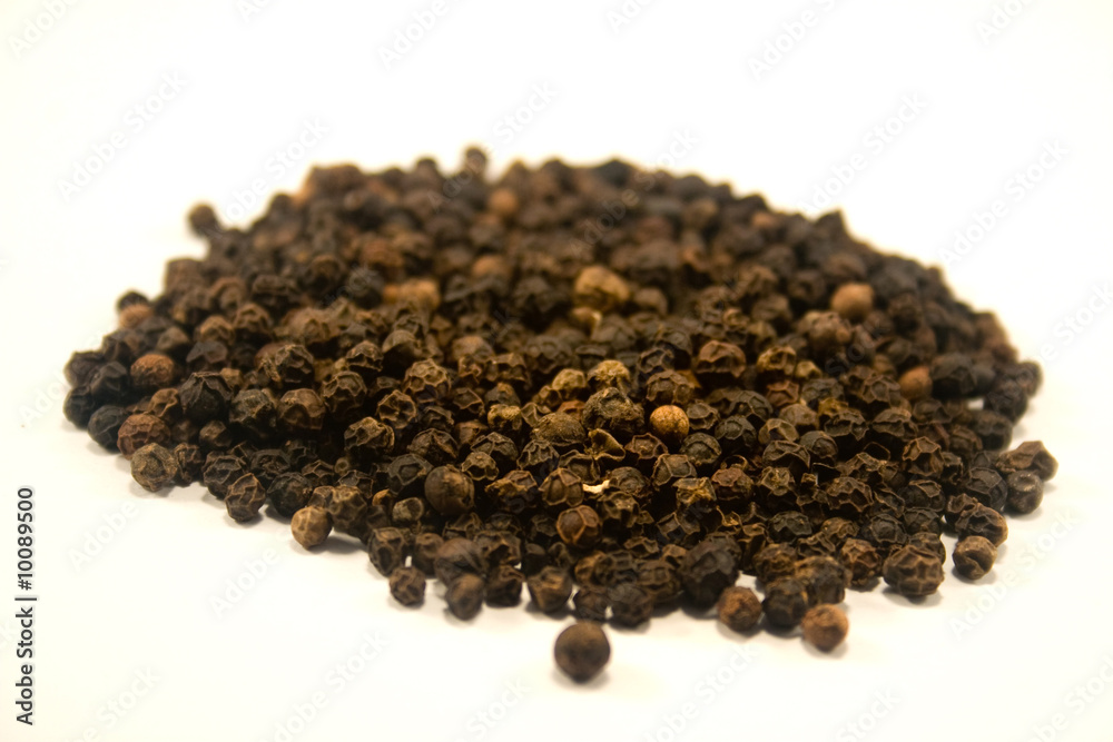 Whole peppercorns isolated on white Whole peppercorns isolated on white