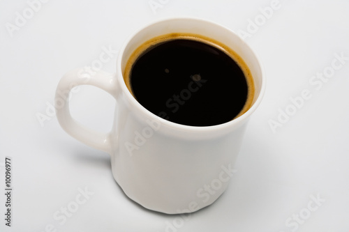 Strong black coffee in a beautiful white cup