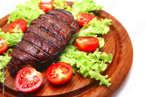 served roasted beef steak on plate
