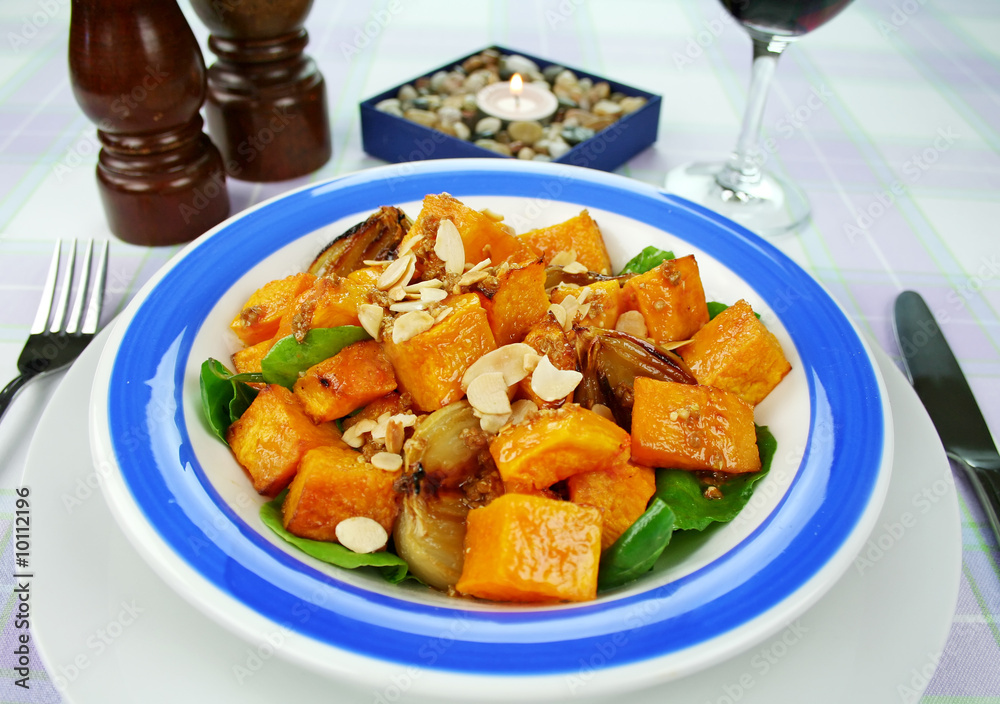 Roasted pumpkin and onion salad with spinach and almonds. Roasted pumpkin and onion salad with spinach and almonds.