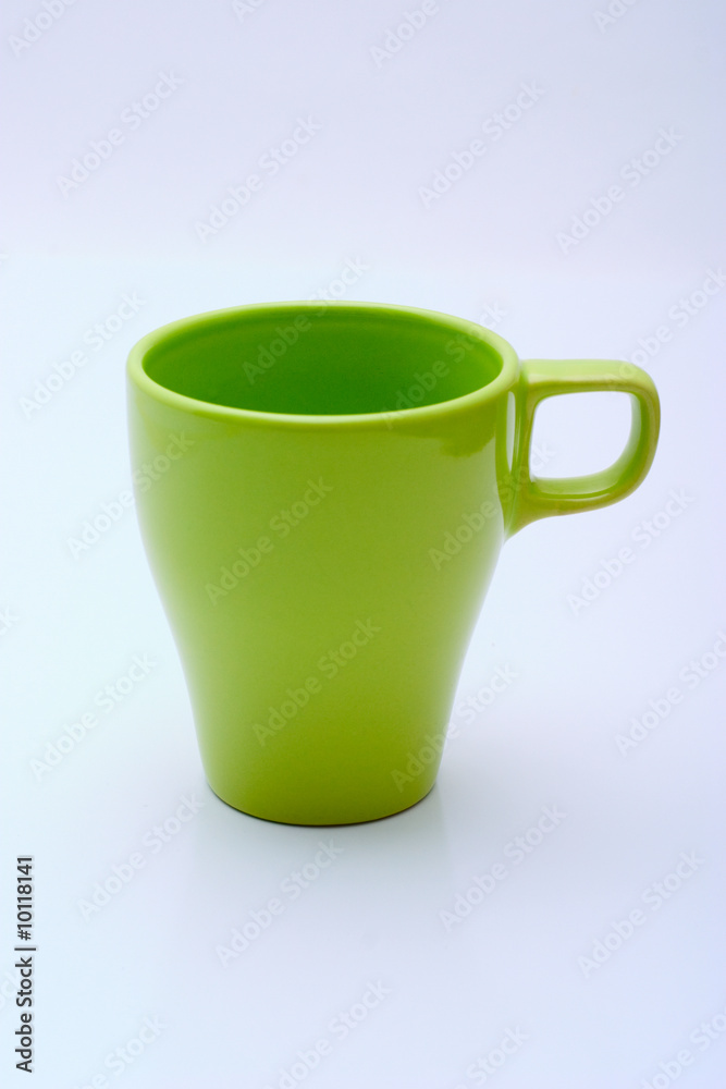 Green mug of modern design on a white background Green mug of modern design on a white background