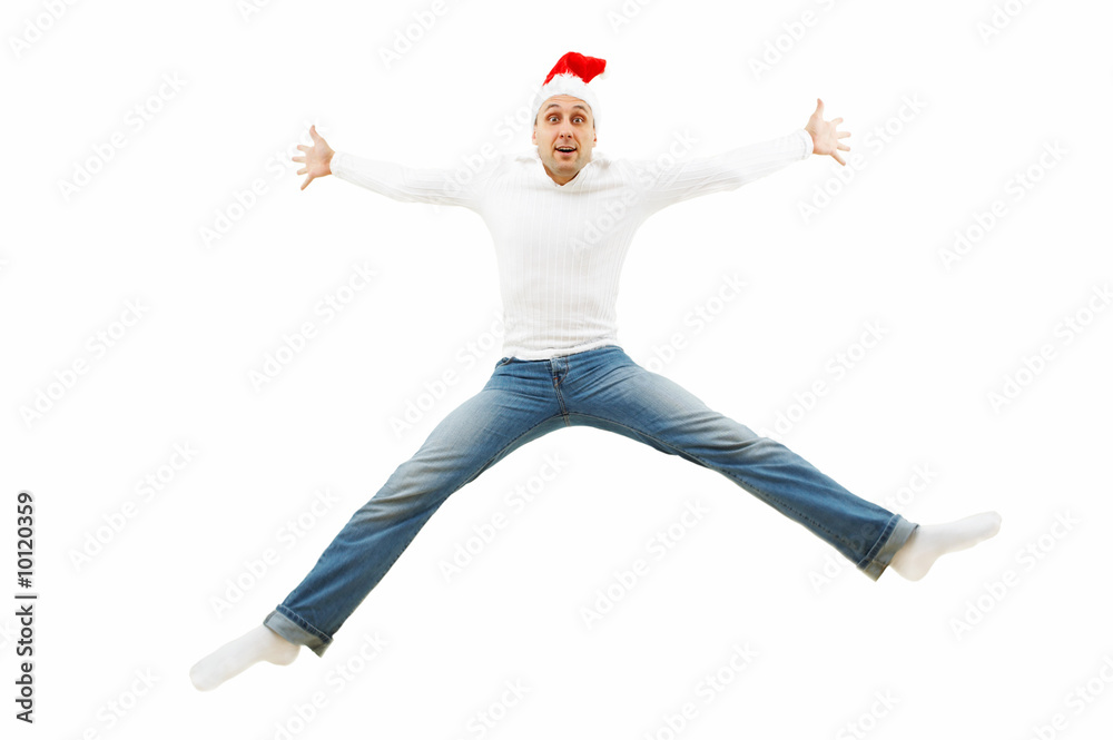The fun man in a cap of the Christmas man is in a jump isolated The fun man in a cap of the Christmas man is in a jump isolated