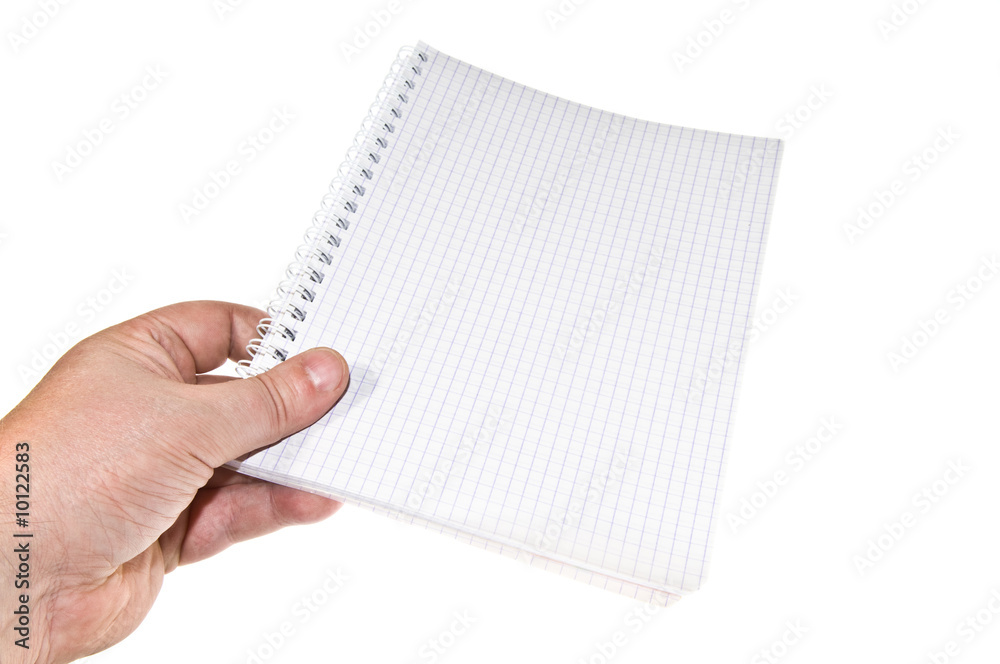 Opened notepad in hand isolated on white background.. Opened notepad in hand isolated on white background..