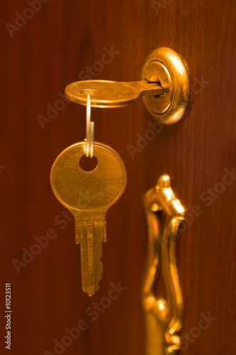 Golden key and lock, abstract security background