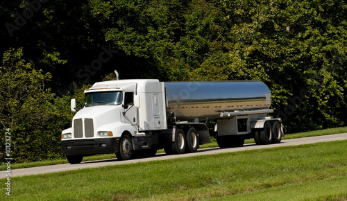 Fotografija A fuel tanker transport truck on a highway, fuel transportaion