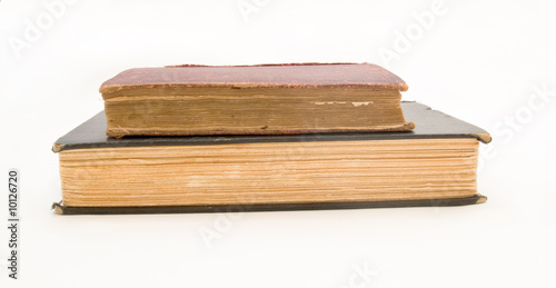Stack of old books, isolated on white.