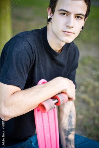 oldschool skater holding this board