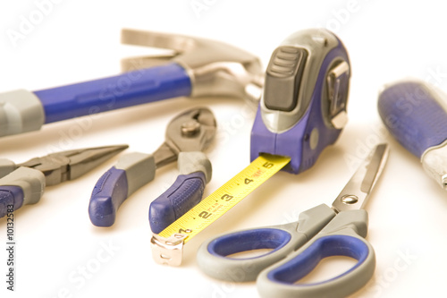 Tools focus on tape measure hammer background