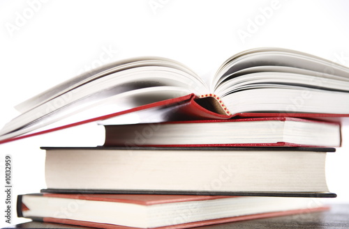 Open book on stack of books
