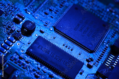 Blue computer board with chips and components