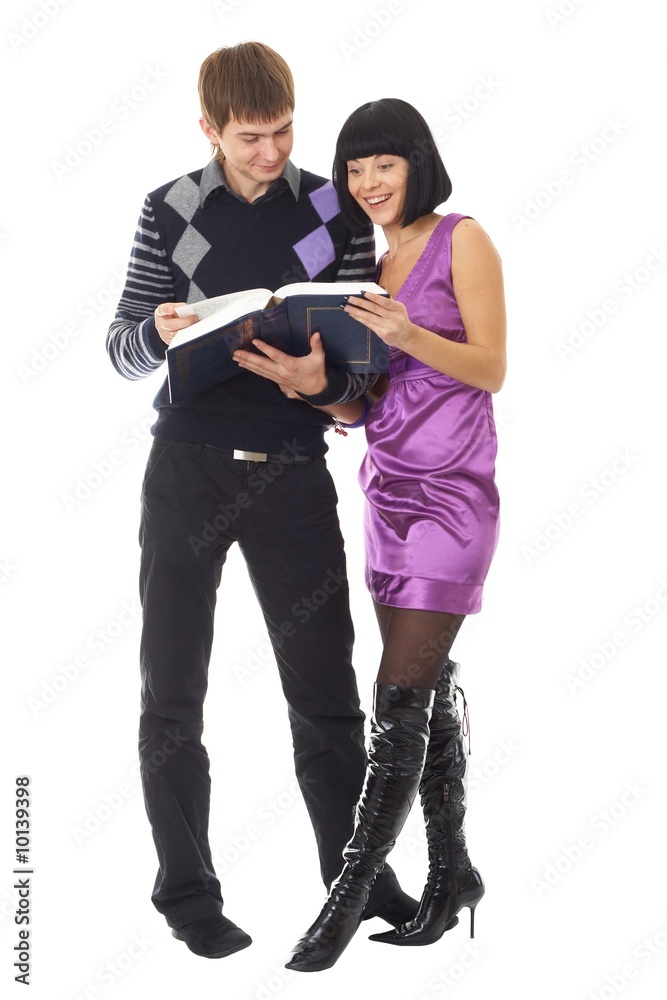 Happy couple with book isolated on white background Happy couple with book isolated on white background