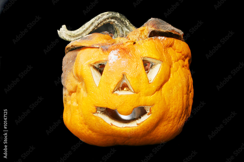 Fototapeta premium Decaying Halloween lantern isolated in black