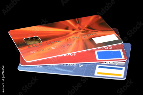 Bank credit or debit cards isolated on black background.