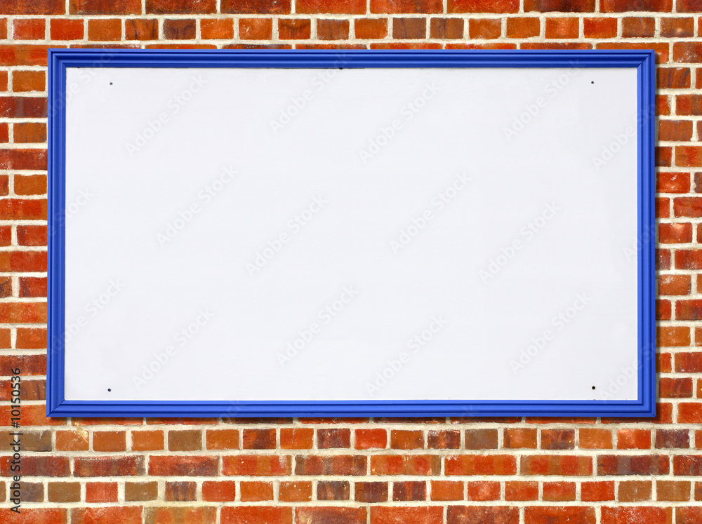 Large white blank billboard sign on a red brick wall. Large white blank billboard sign on a red brick wall.