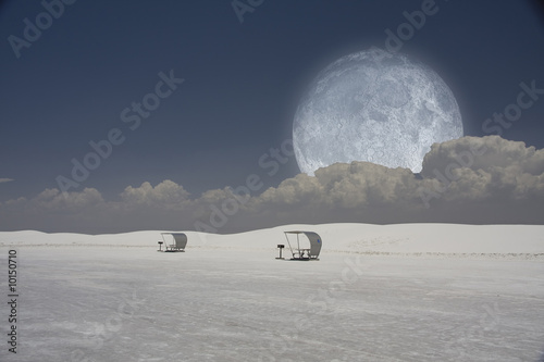 Surreal image with sleds and moon © rolffimages
