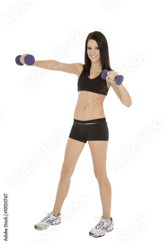 Beautiful Caucasian woman working out with dumbbells