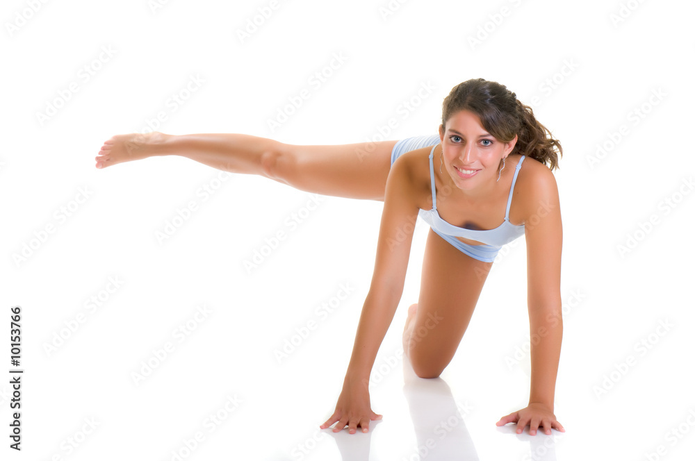Young attractive female doing fitness, yoga exercises Young attractive female doing fitness, yoga exercises