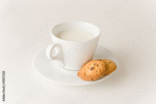 Cup of coffee with milk and cookies  studio isolated