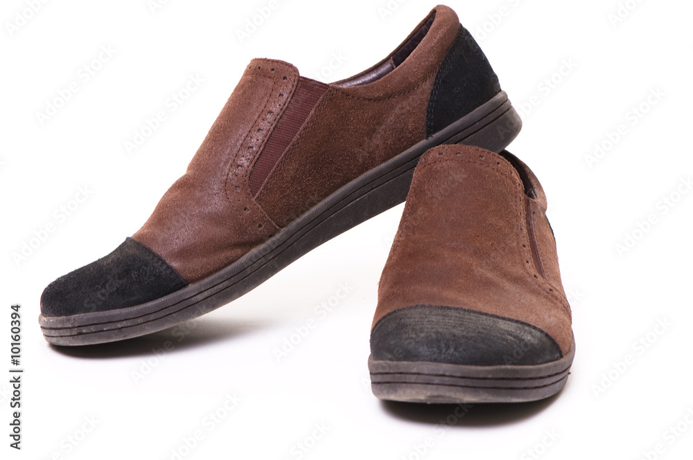 brown shoes over white background
