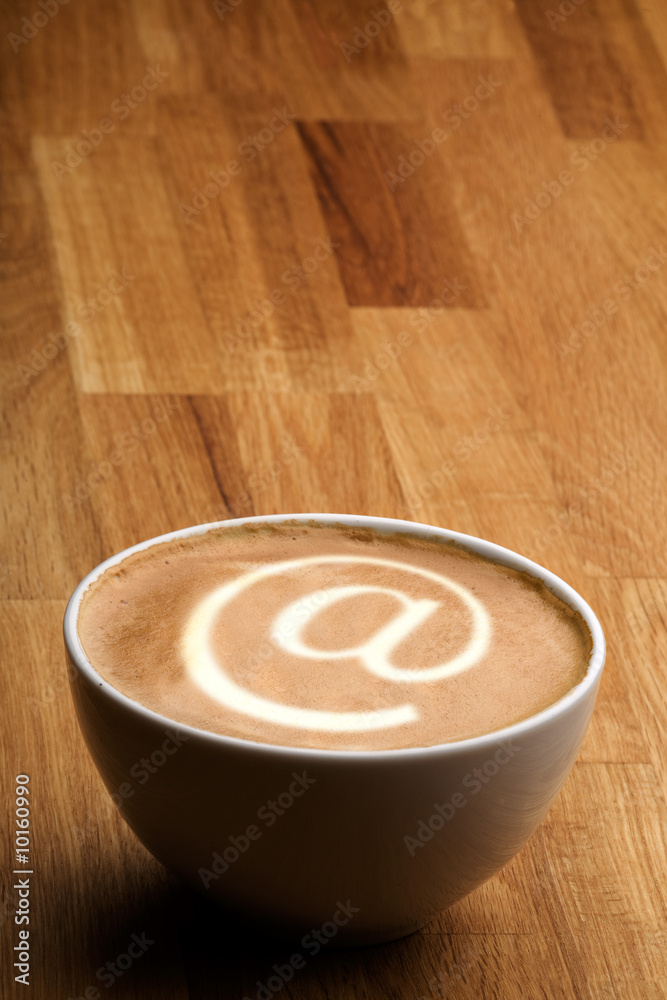 A cappuccino with an @ sybol in the milk