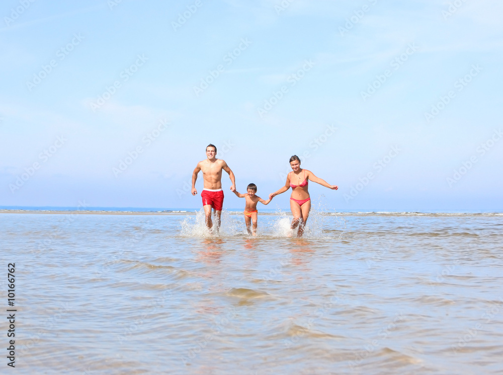 happy family having fun on the beach