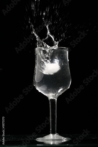 alcohol splash on black background
