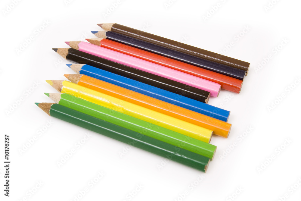 Coloured drawing pencils isolated on a white studio background. Coloured drawing pencils isolated on a white studio background.