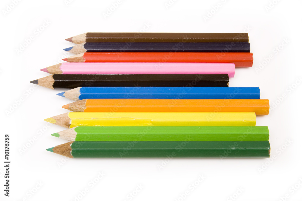 Coloured drawing pencils isolated on a white studio background. Coloured drawing pencils isolated on a white studio background.