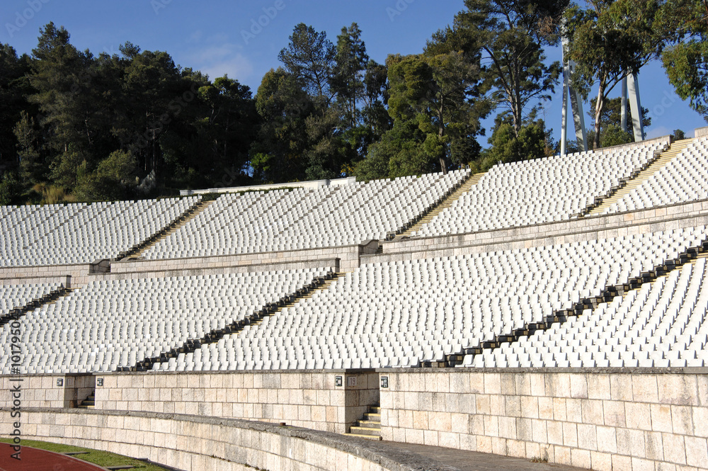 Fototapeta premium Empty stadium with lots of white chairs