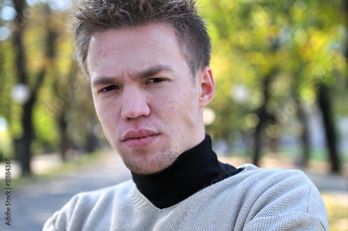 happy young casual man outdoor portrait posing