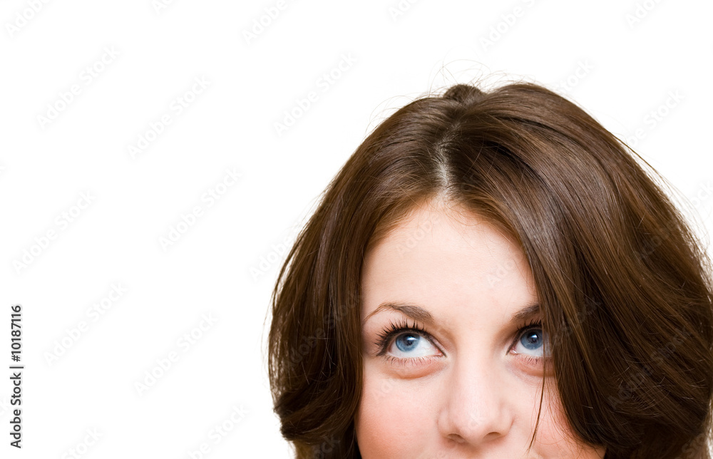 Cute teenager isolated on white, looking up in the corner Cute teenager isolated on white, looking up in the corner