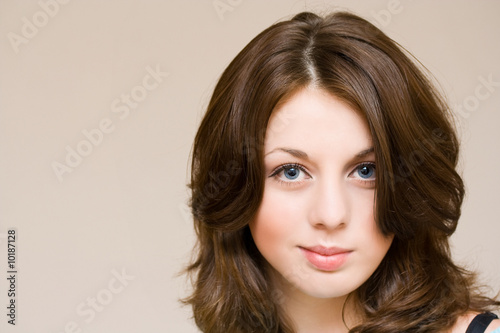 Close-up portrait of a beautiful girl with blue eyes, isolated