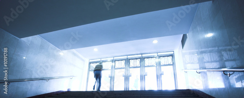 People mooving in hall corridor