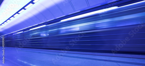 mooving train on platform in subway