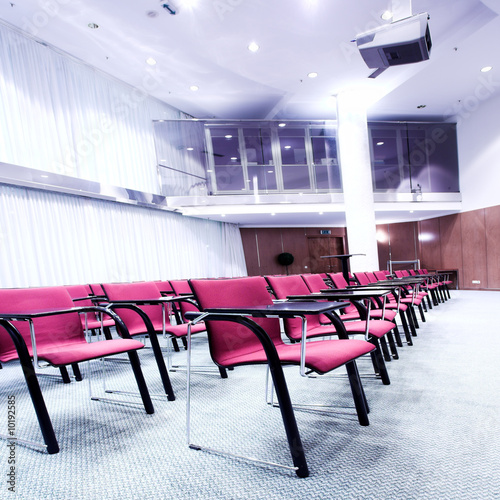 red chairs rows in conference hall